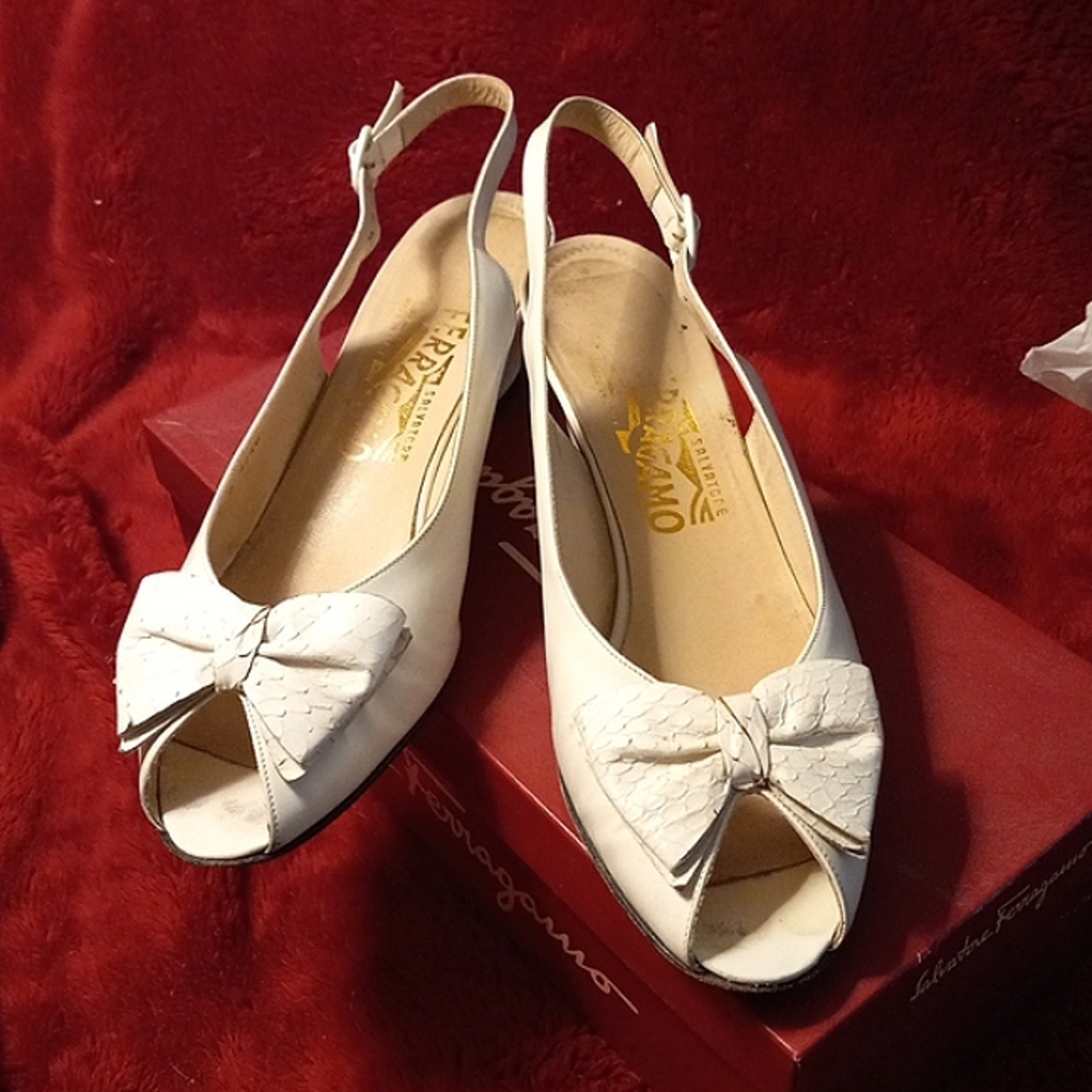 Salvatore Ferragamo white leather open toed sling with white snakeskin bow.